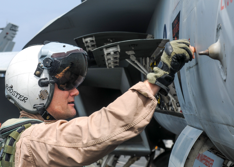 Pilot does a final walk around to make sure all is well with his mount.